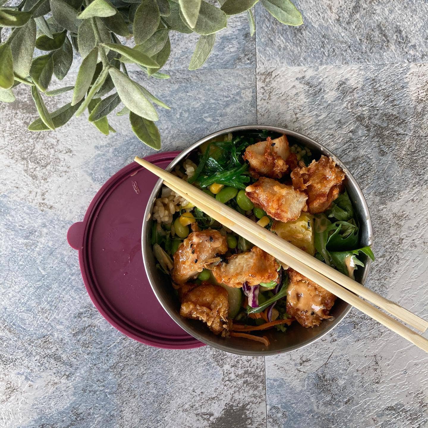 Stainless steel food container with silicone lid